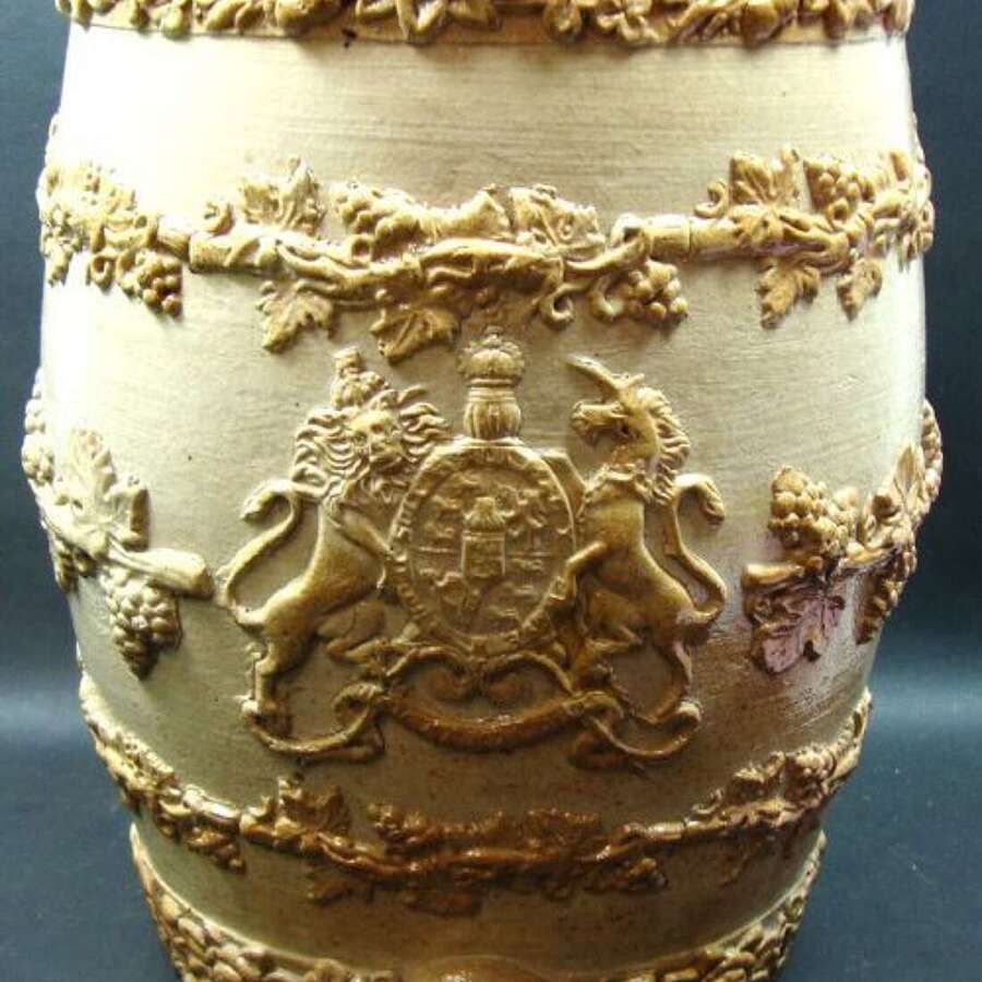 A Salt Glaze 2 Gallon Wine Barrel With Applied Royal Coat Of Arms And Fruiting Vinesmarked