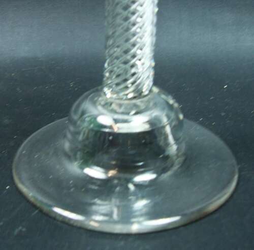 Air twist wine glass with flared bowl and high domed foot English circa 1750