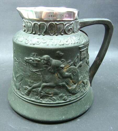A silver mounted black ceramic jug 'The Bell Edmonton' 1895