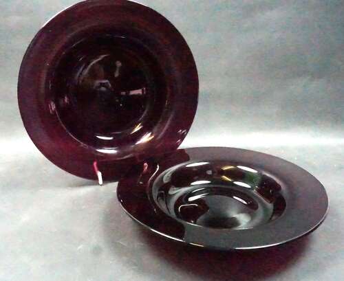 A pair of amethyst glass under plates, English c.1800