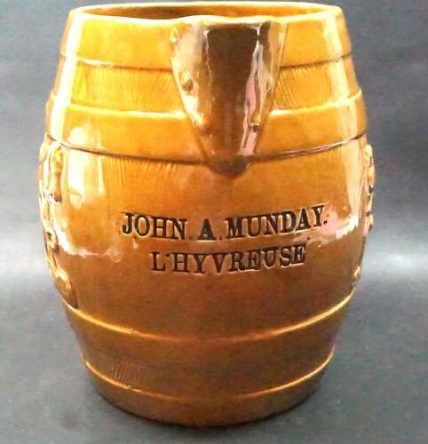 A large antique ceramic jug marked 'John A Munday - L'Hyvreuse '(Guernsey)