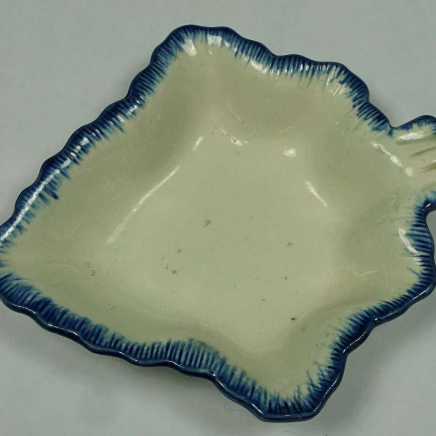 A cream ware pickle leaf with blue painted rim, English c.1780